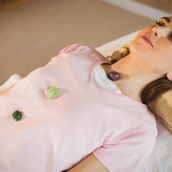 Healing crystals placed on a patient during a crystal healing session