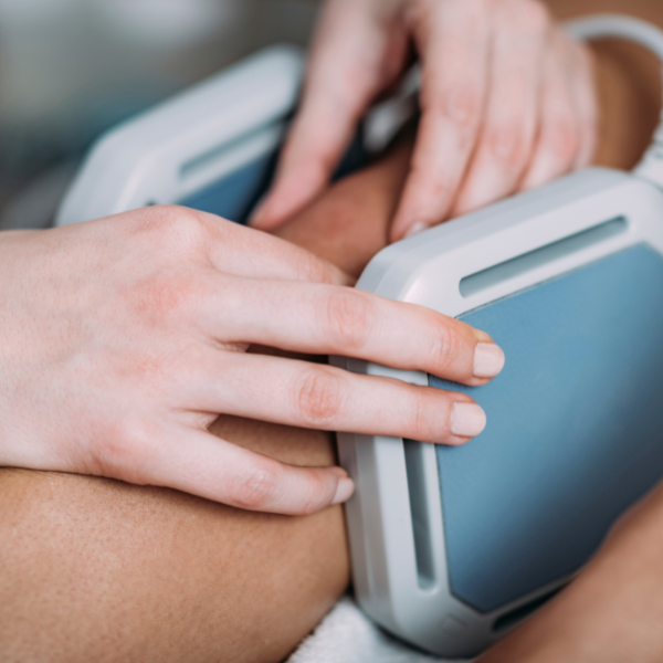 Practitioner using magnets to alleviate pain during a magnetotherapy session